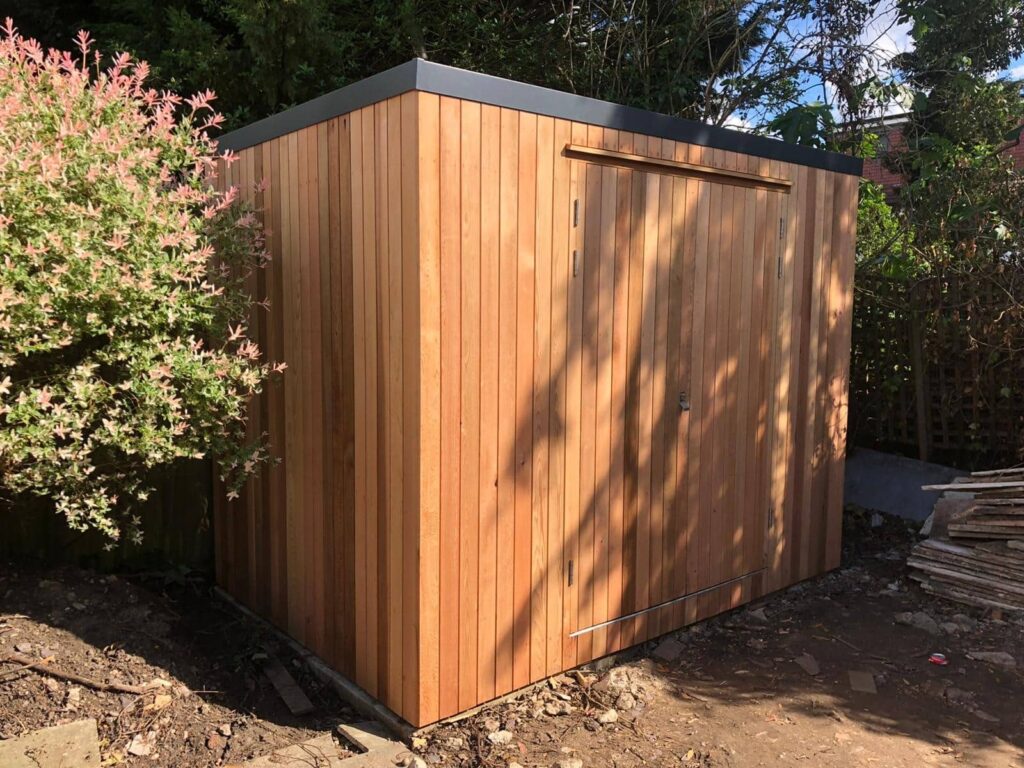 Cedar clad shed to match garden room - London