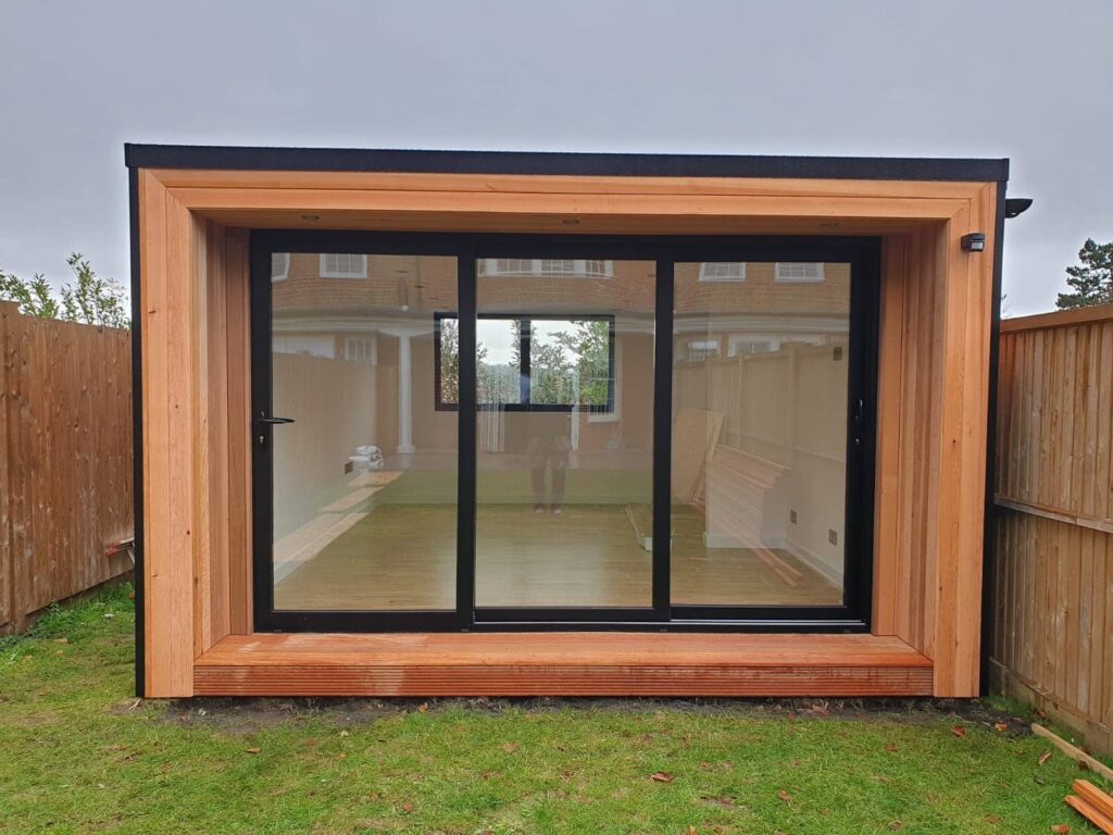 Beautiful bespoke cedar and black aluminium garden office in Surrey - eden garden rooms